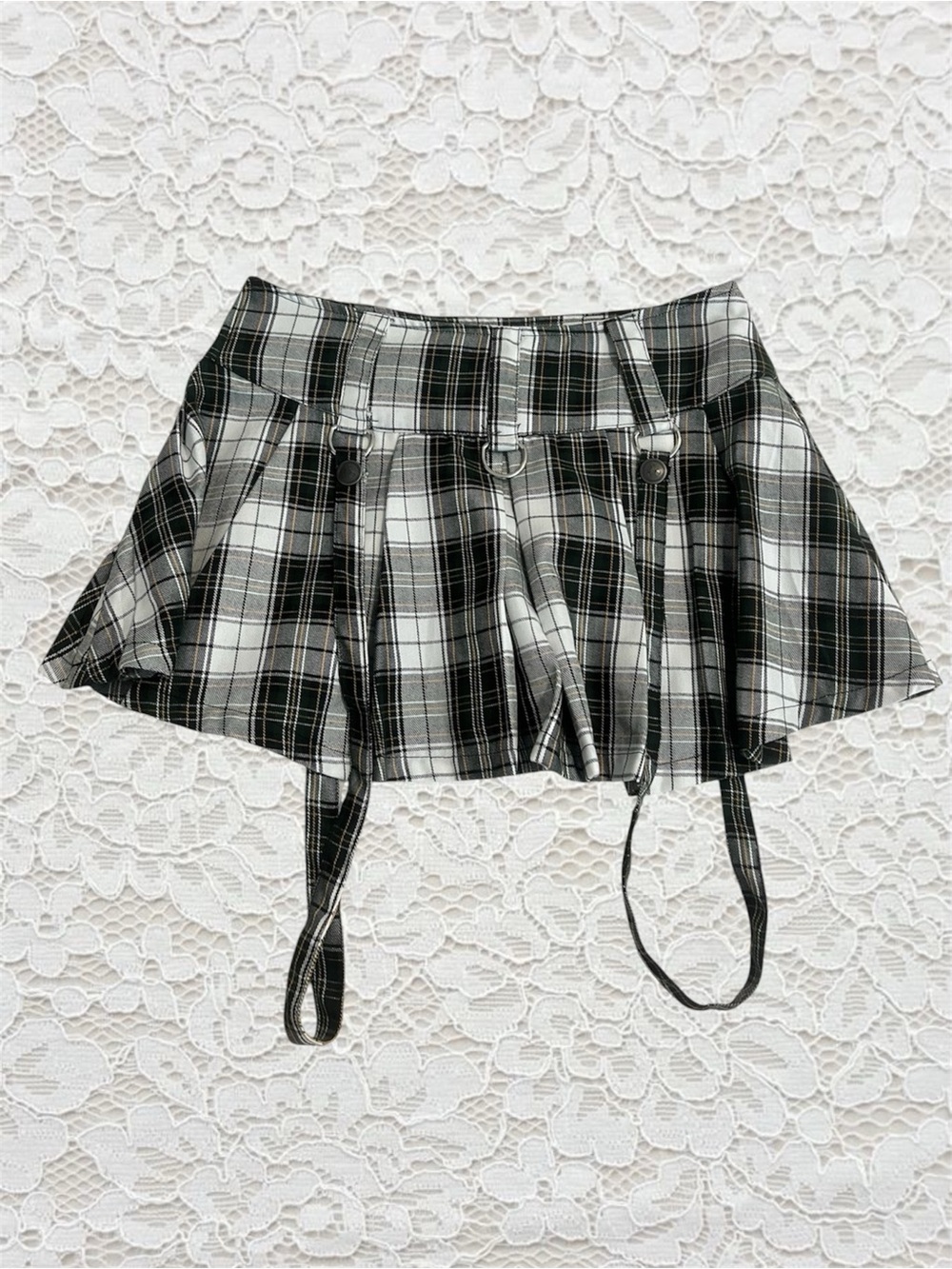 green, black, and white plaid mini skirt with straps